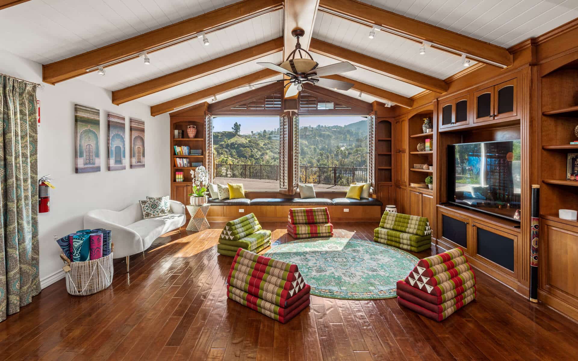 A wood-beamed family room at My Limitless Journeys overlooking the Encino hillside